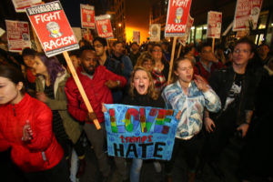 SEATTLE, WA - NOVEMBER 09: Emma Esselstyn (C), a student at the University of Washington joins thousands of protesters march down 2nd Avenue on November 9, 2016 in Seattle, Washington. Demostrations in multiple cities around the country were held the day following Donald Trump's upset win in last night's U.S. presidential election. (Photo by Karen Ducey/Getty Images)